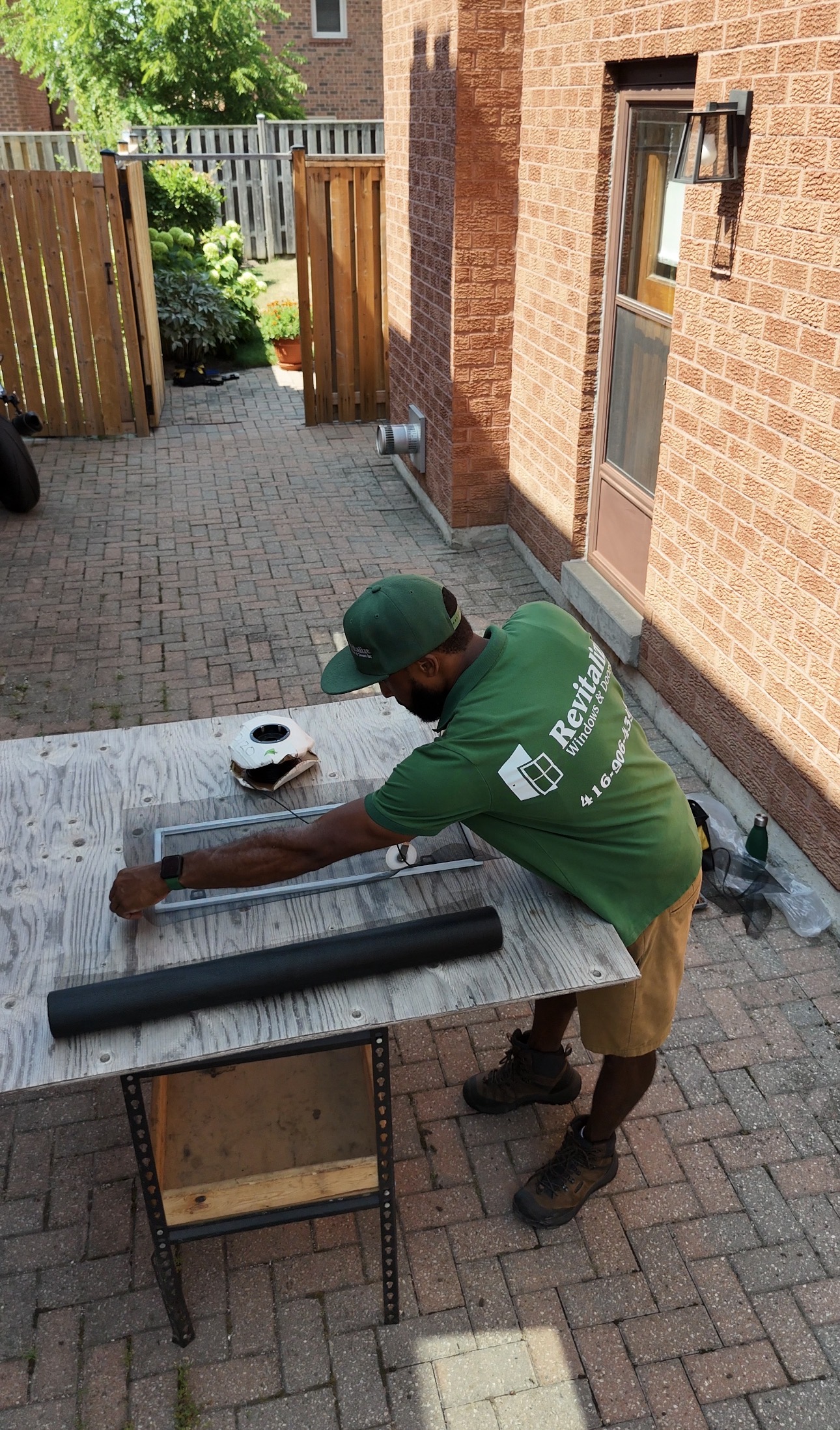 technician repairing window screen in Toronto