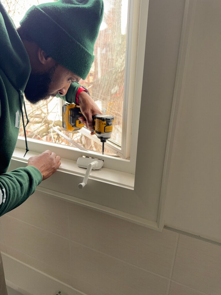 window technician fixing broken window crank in Toronto