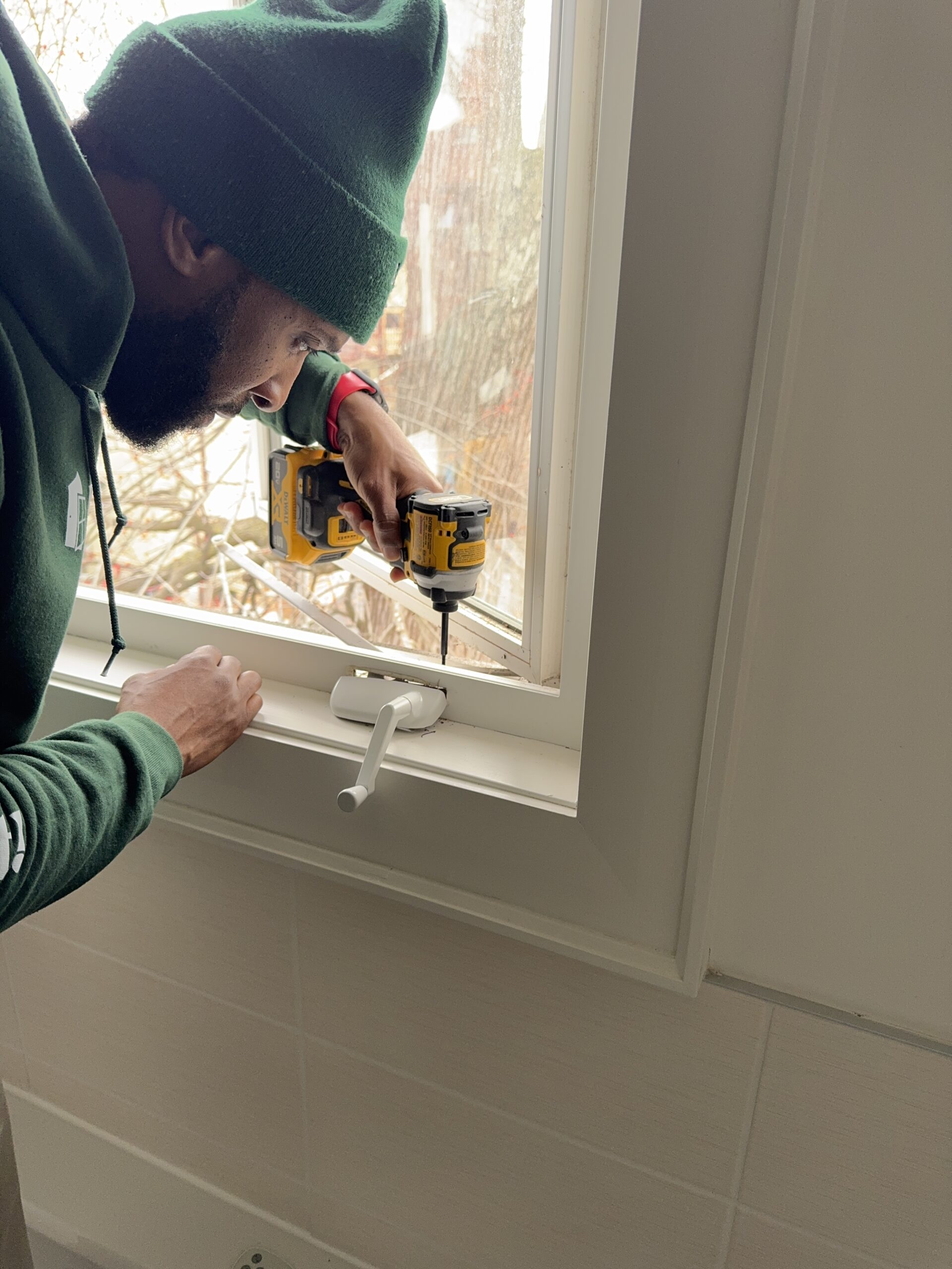 window technician, repairing window crank.